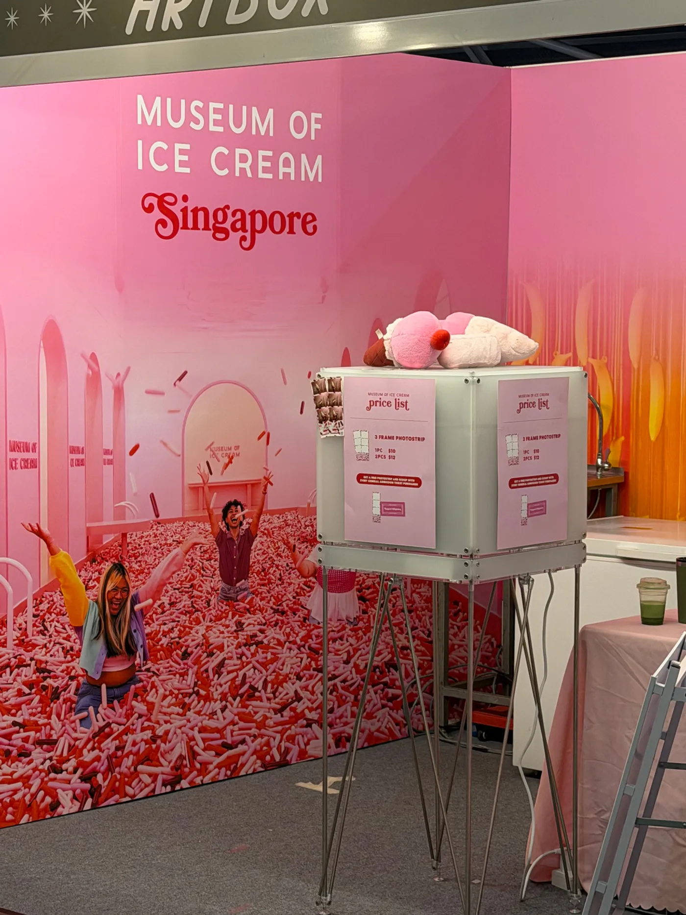 A pink PickyPic booth beside the Museum of Ice Cream stand at ARTBOX Singapore