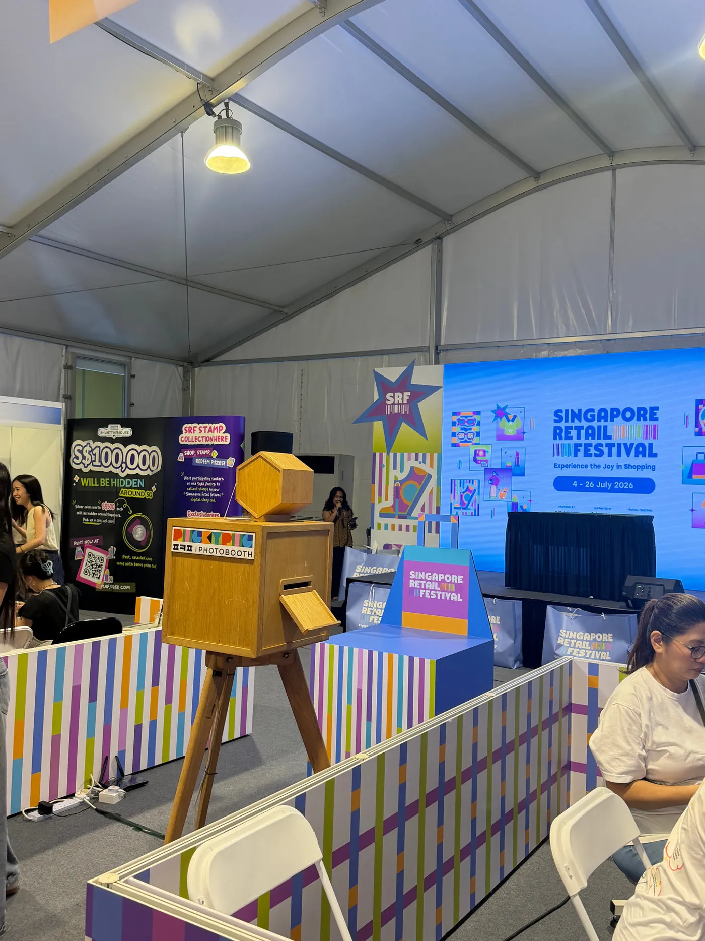 A wooden PickyPic booth on the festival floor at Singapore Retail Festival